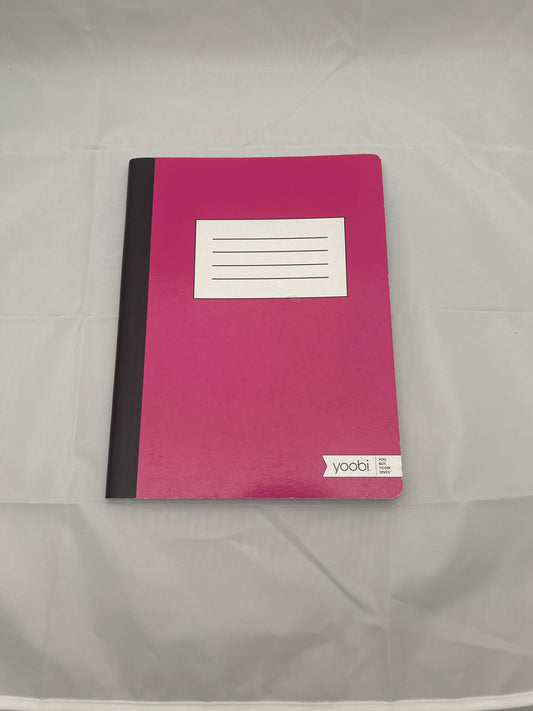 Pink notebook with a white label on a gray background