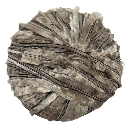 Round decorative item with zippers on a white background
