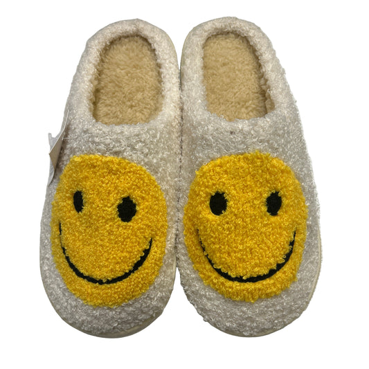 Pair of slippers with smiley face design on a white background
