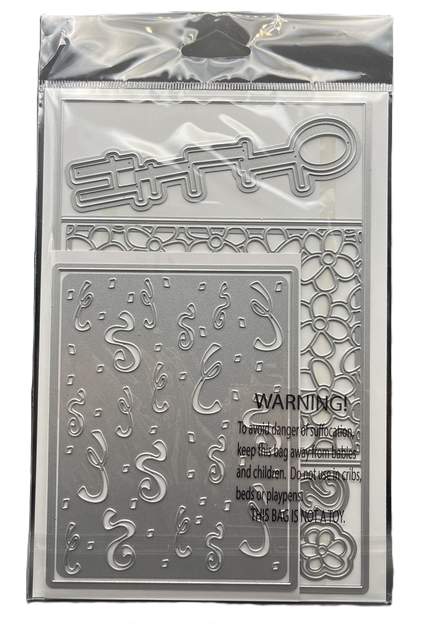 Metal die set with decorative cutouts and warning label on a clear background