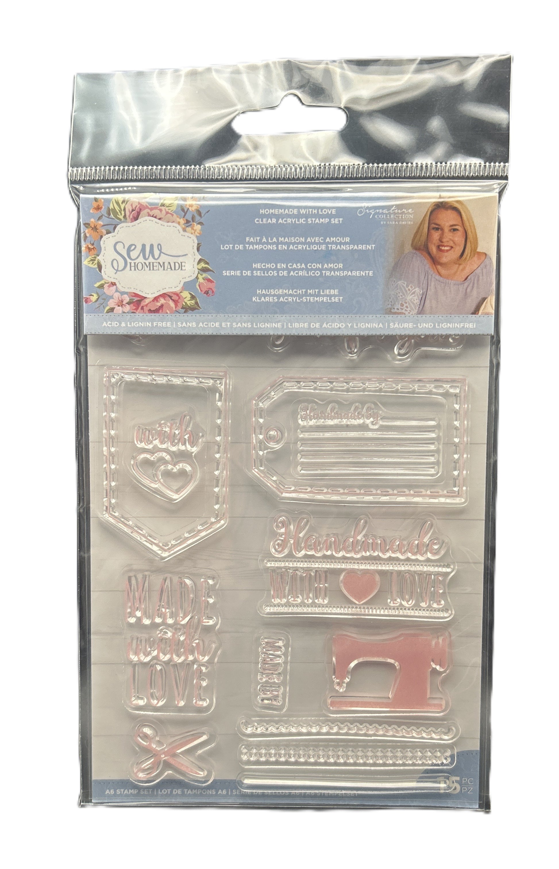 Packaged clear stamp set with sewing-themed designs on a white background