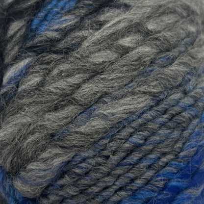 Ball of gray and blue yarn on a white background