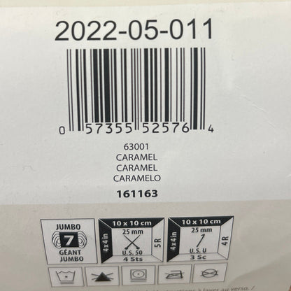 Close-up of a label on a yarn with barcode and text.