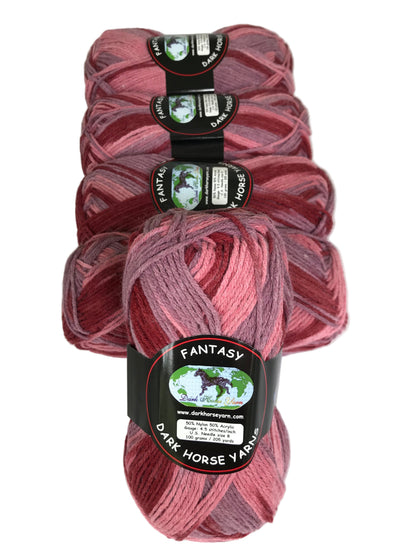 Four skeins of pink yarn with labels on a white background