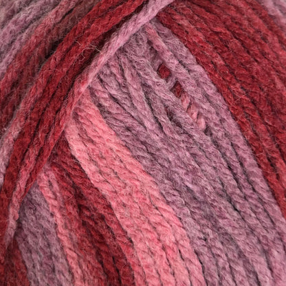 Multicolored yarn ball with a label on a white background