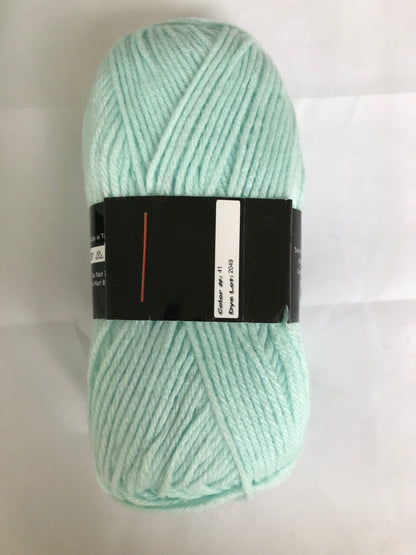 Light green skein of yarn with a black label on a white background