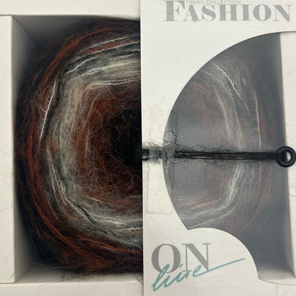Yarn skein in a 'Fashion Box' packaging with a visible brand name.