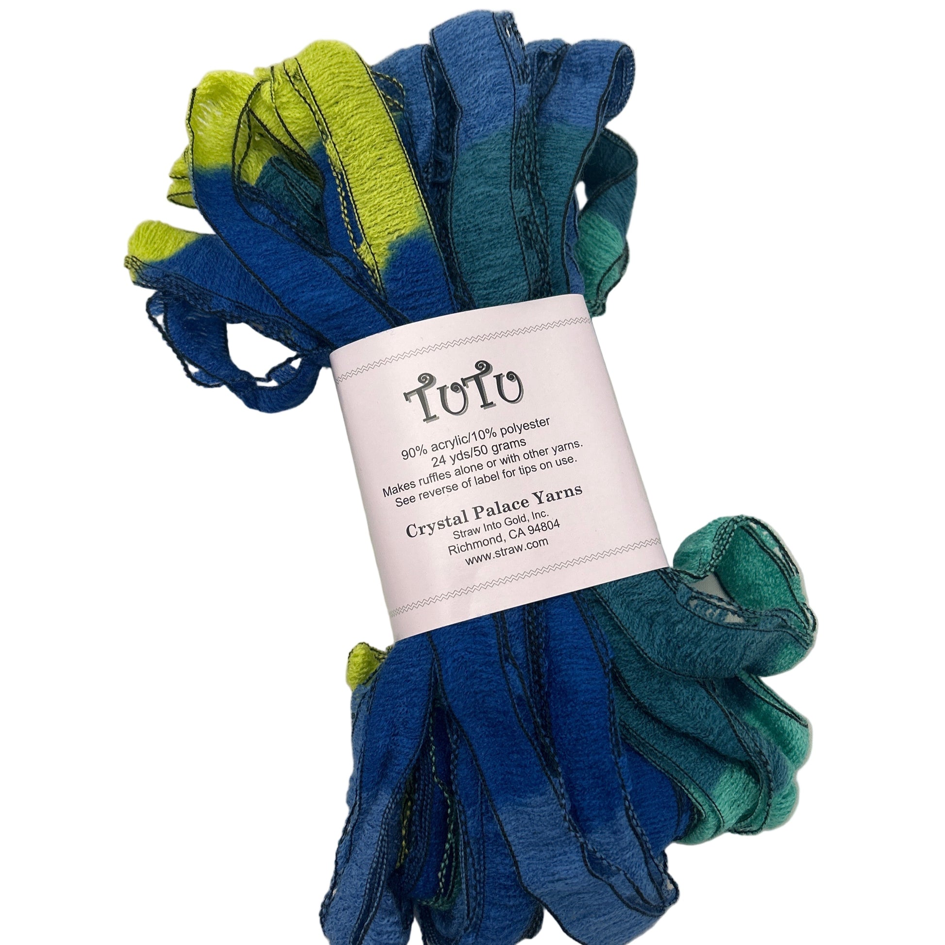 Bunch of blue and green yarn with a label on a white background