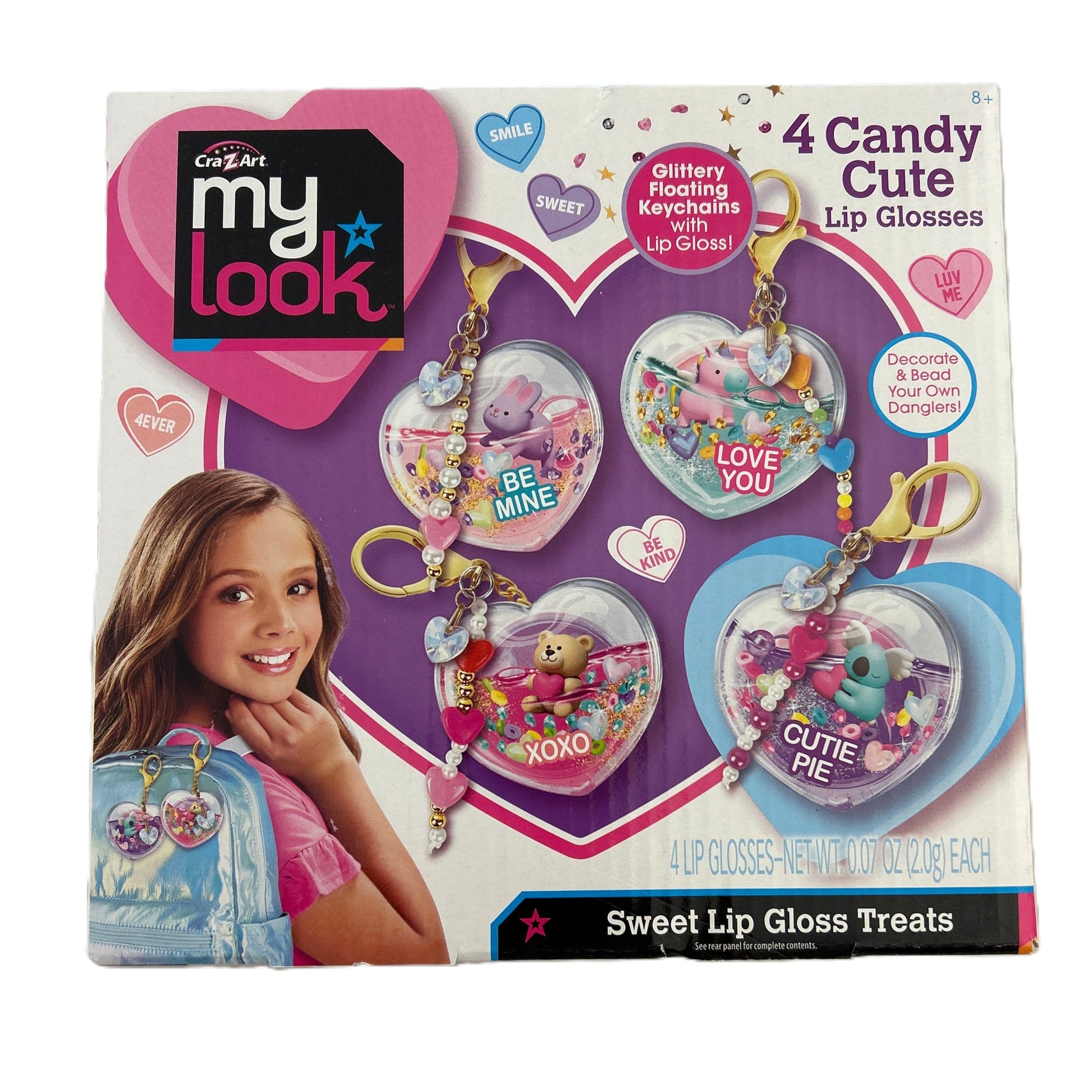My Look candy cute lip gloss packaging with a girl and lip gloss keychains on a purple background