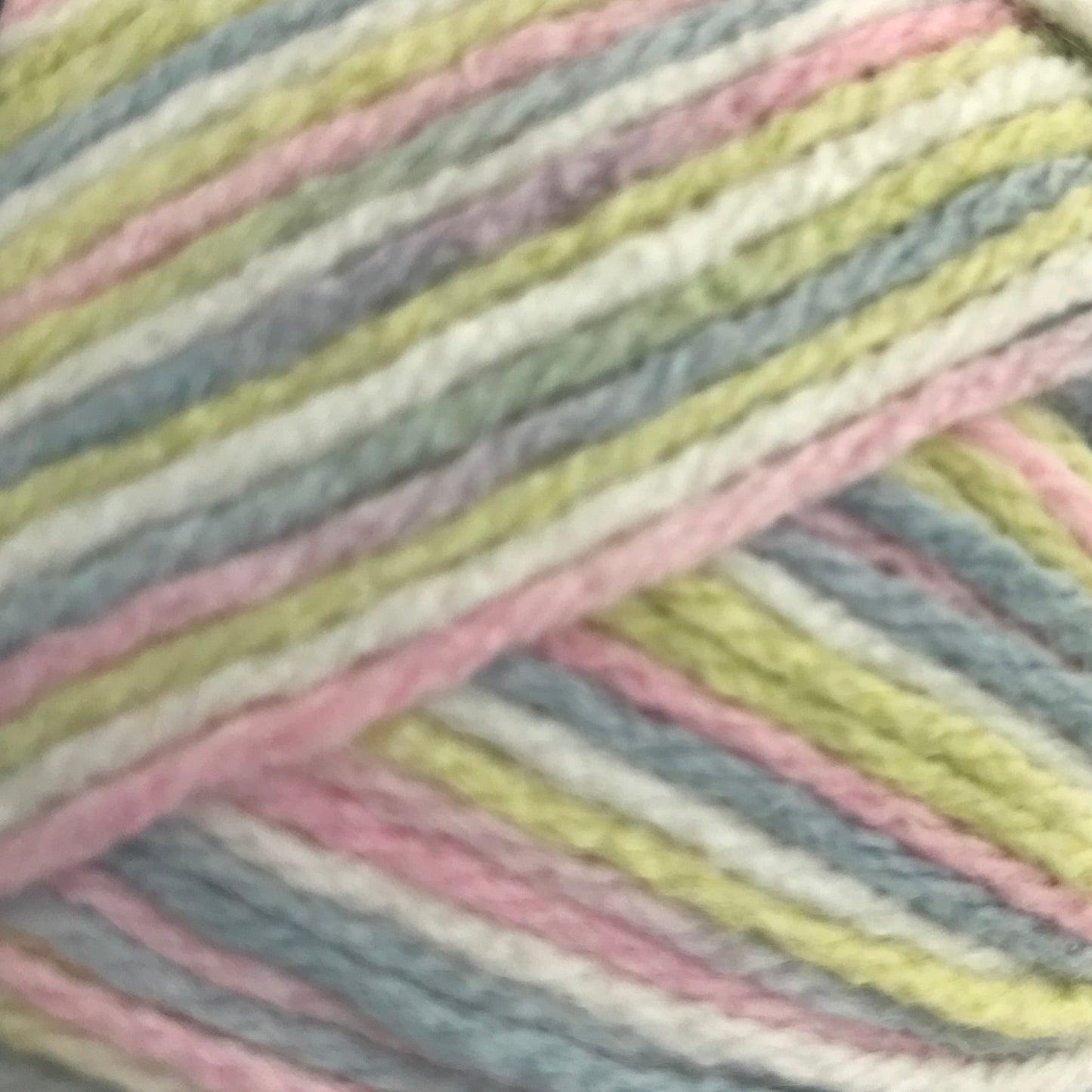 Multicolored skein of yarn on a light gray background