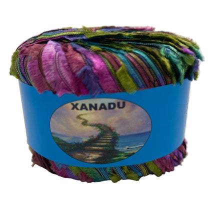 Multicolored yarn ball with a blue Xanadu label on a white background