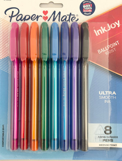 Pack of Paper Mate InkJoy ballpoint pens in various colors on a beige background