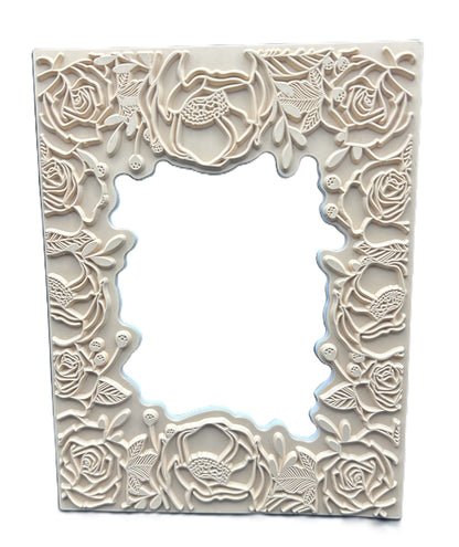 Decorative white frame with floral patterns on a white background