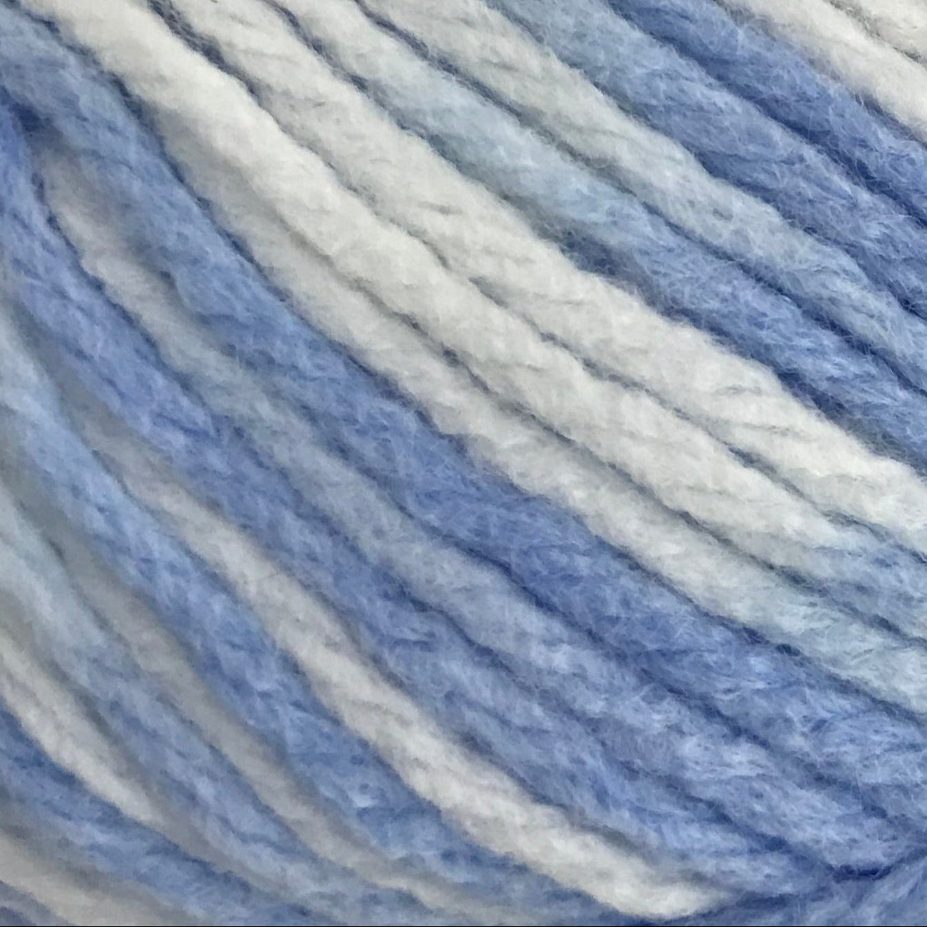 Close-up of blue and gray yarn with horizontal stripes
