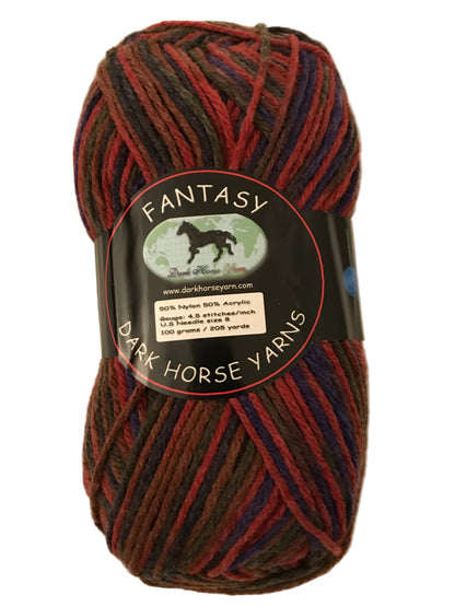 Multicolored skein of yarn with 'Fantasy' label on a beige background