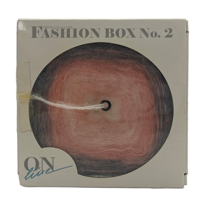 Makeup product in a box labeled 'Fashion Box No. 2' on a white background