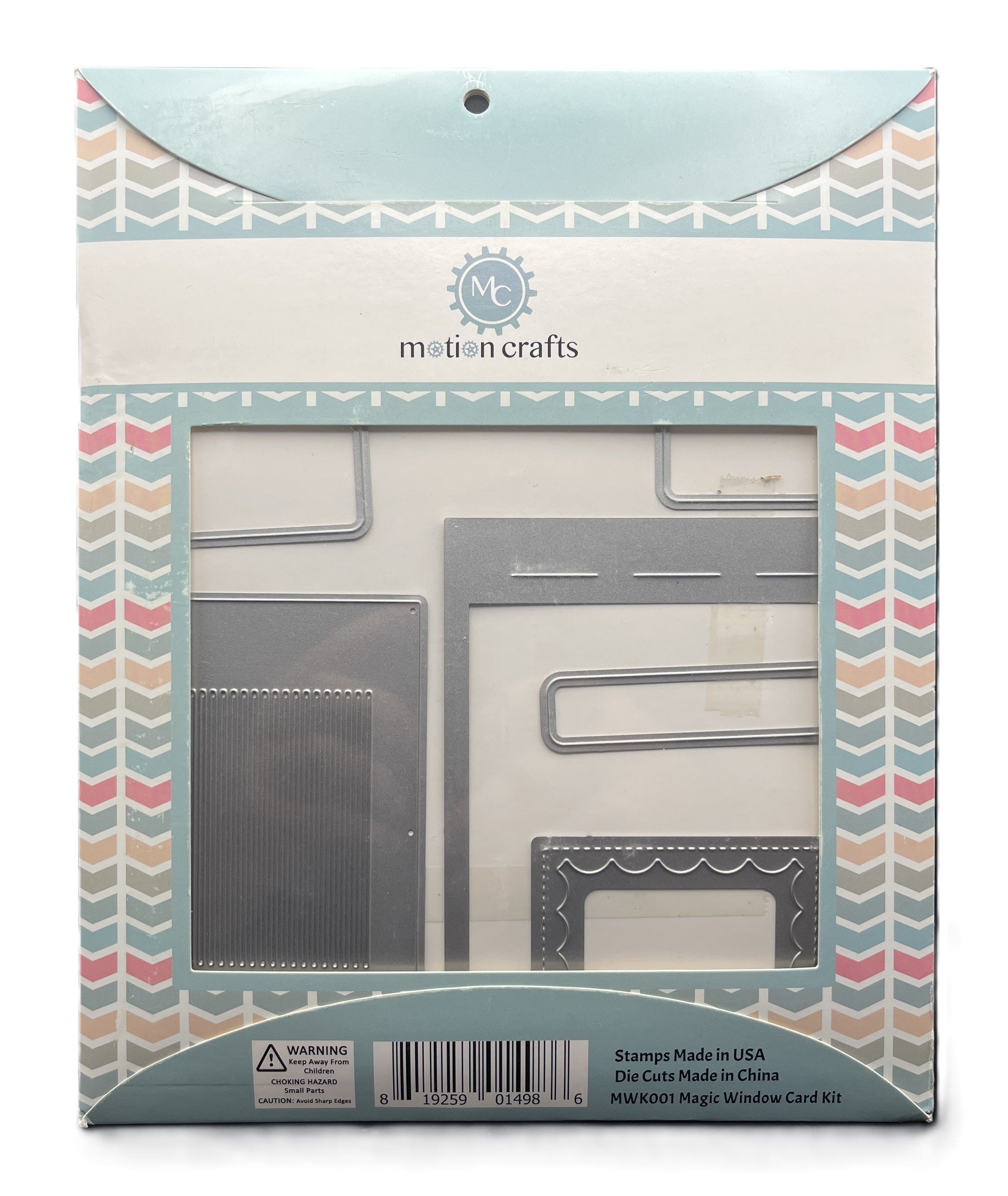 Packaged set of metal stamps and dies with 'MC' branding on a decorative box.