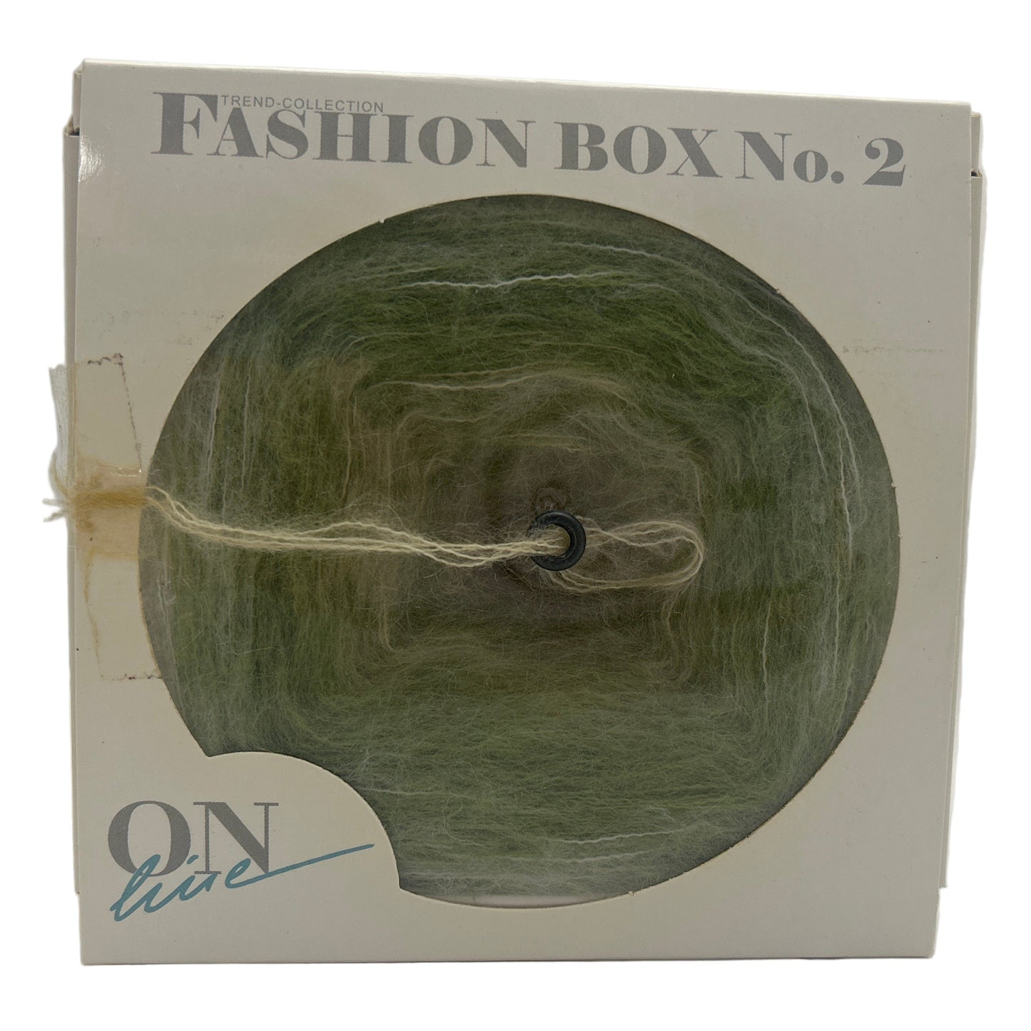 Box with green yarn and 'Fashion Box No. 2' text on a white background