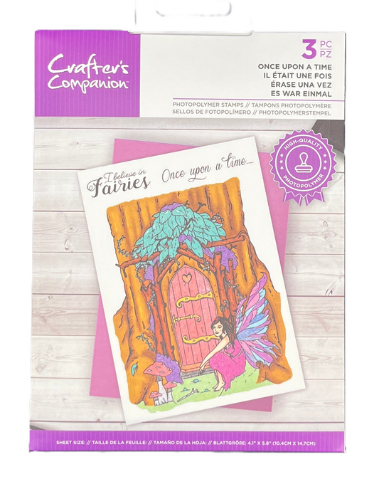 Crafter's Companion stamp set packaging with fairy door design on a wooden surface