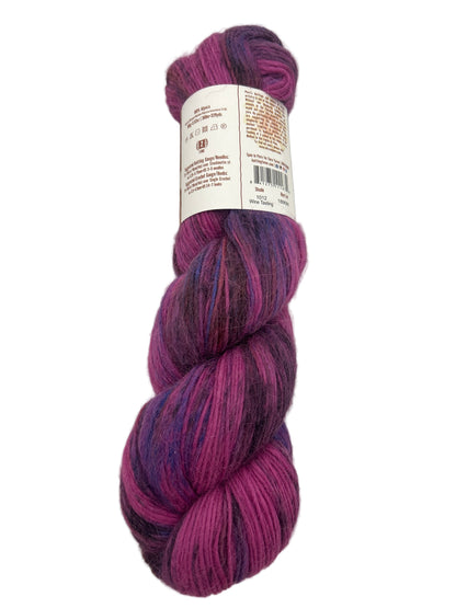 Purple skein of yarn with a label on a light gray background