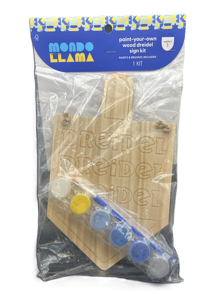 Wooden dreidel sign kit with paint and brushes in packaging, brand 'Mondo Llama' visible.
