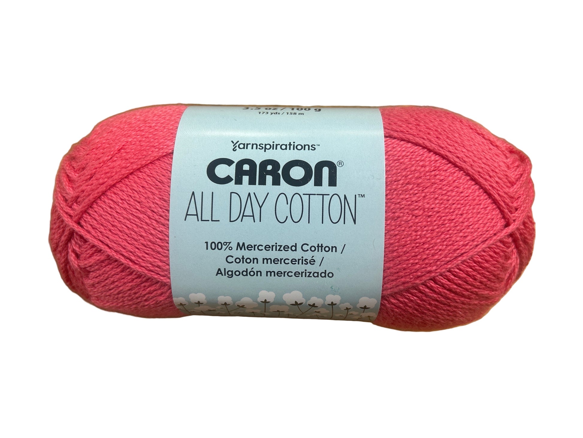 Ball of pink yarn with Caron label on a white background