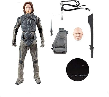 Action figure with accessories and 'Dune' branding on a white background