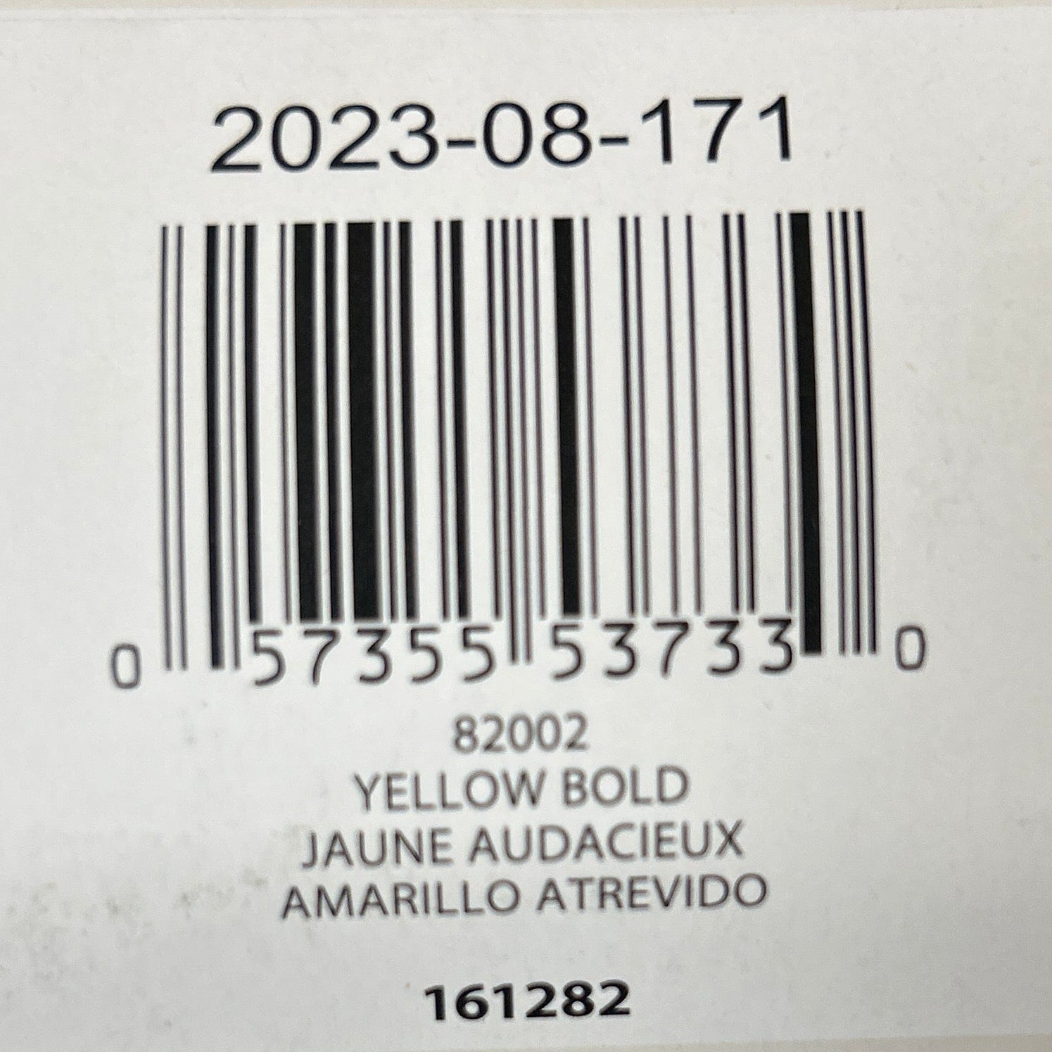 Product label with bar code and text on a textured surface