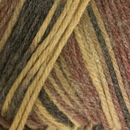 Close-up of multicolored yarn with brown, yellow, and red tones.