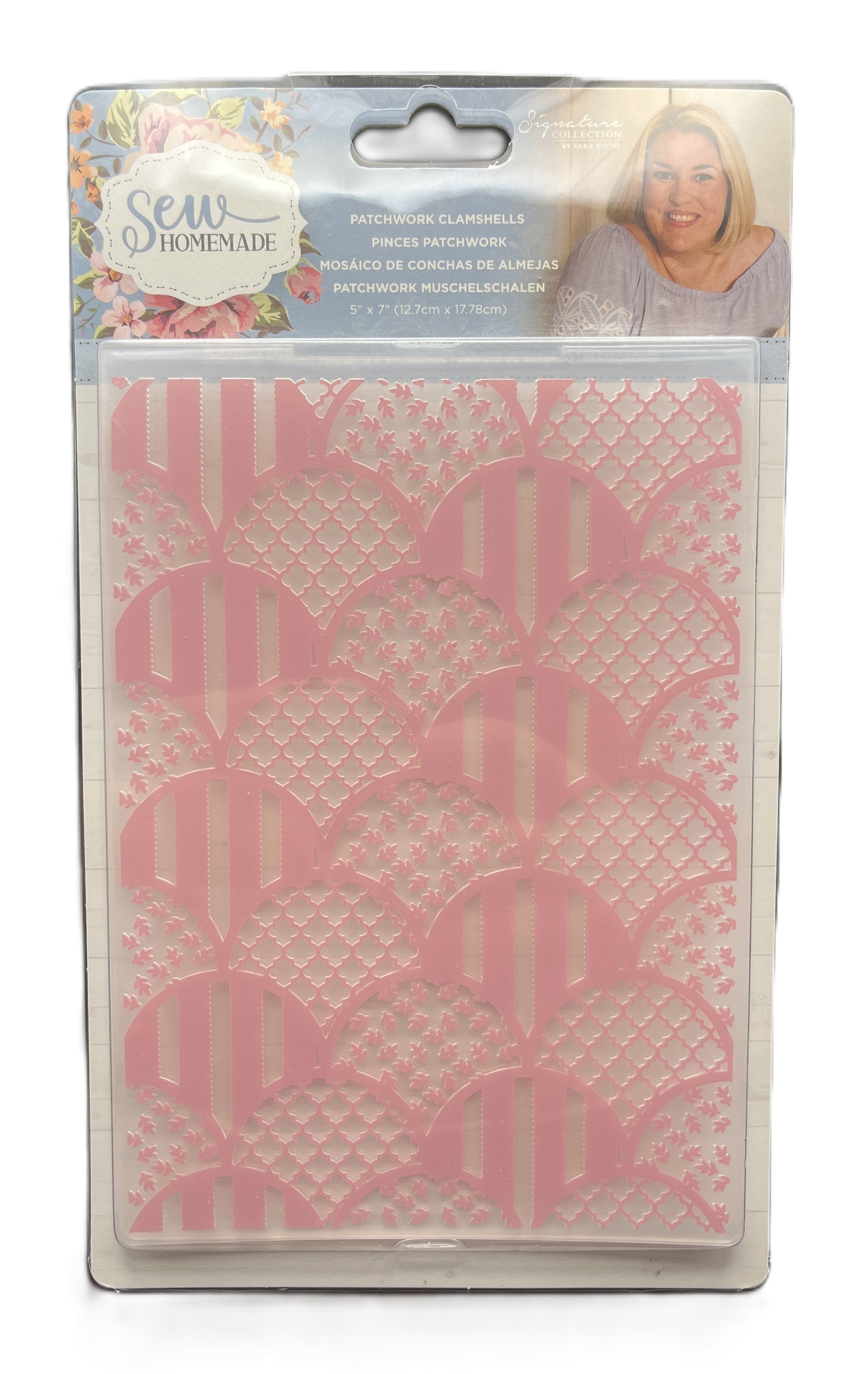 Packaged product with pink lace pattern on a white background