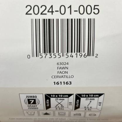 Close-up of a label on a woven product with text and barcodes.