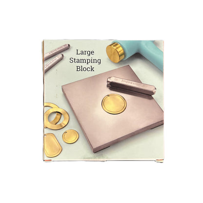 Large stamping block with gold stamps on a white background