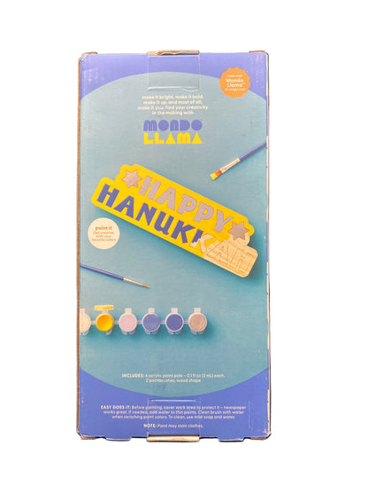 Box with 'Happy Hanukkah' text and illustrations on a dark background