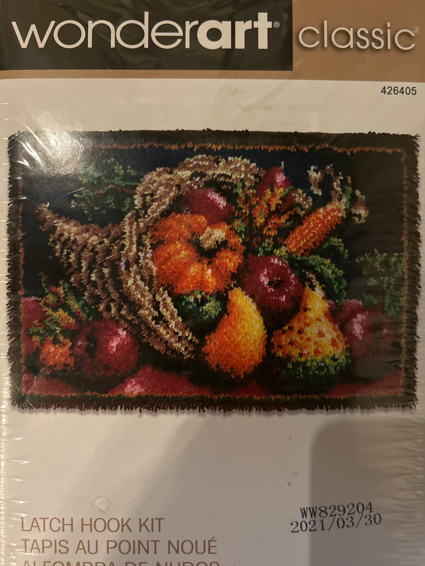 Latch hook kit with a fruit and vegetable design on packaging