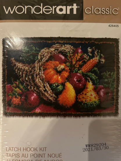 Latch hook kit with a fruit and vegetable design on packaging