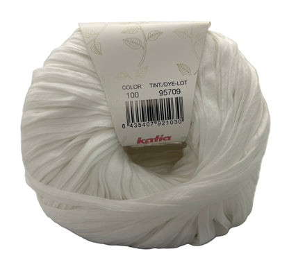 White yarn ball with a label on a white background