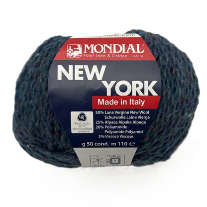 Ball of yarn with Mondial New York label on a white background
