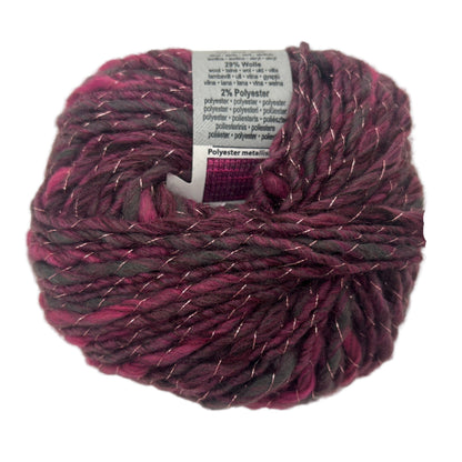 Ball of purple yarn with a label on a white background