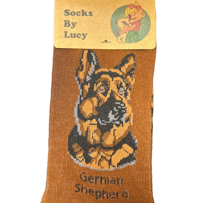 Brown sock with German Shepherd design on a dark surface, featuring a label.