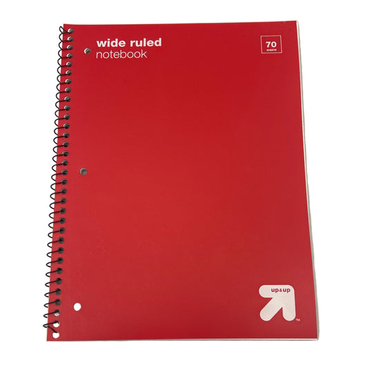 Red notebook with 'wide ruled' text and Up & Up logo on a white background