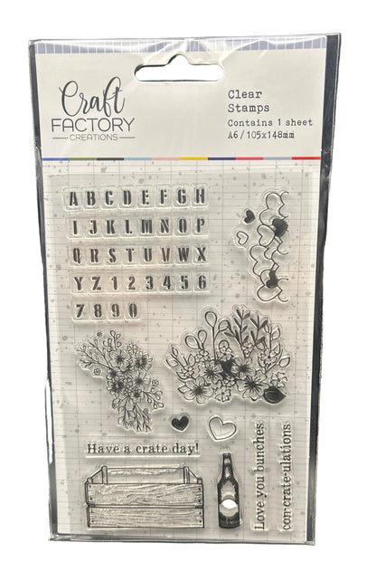 Packaged clear stamps with various designs and text from Craft Factory on a white background.