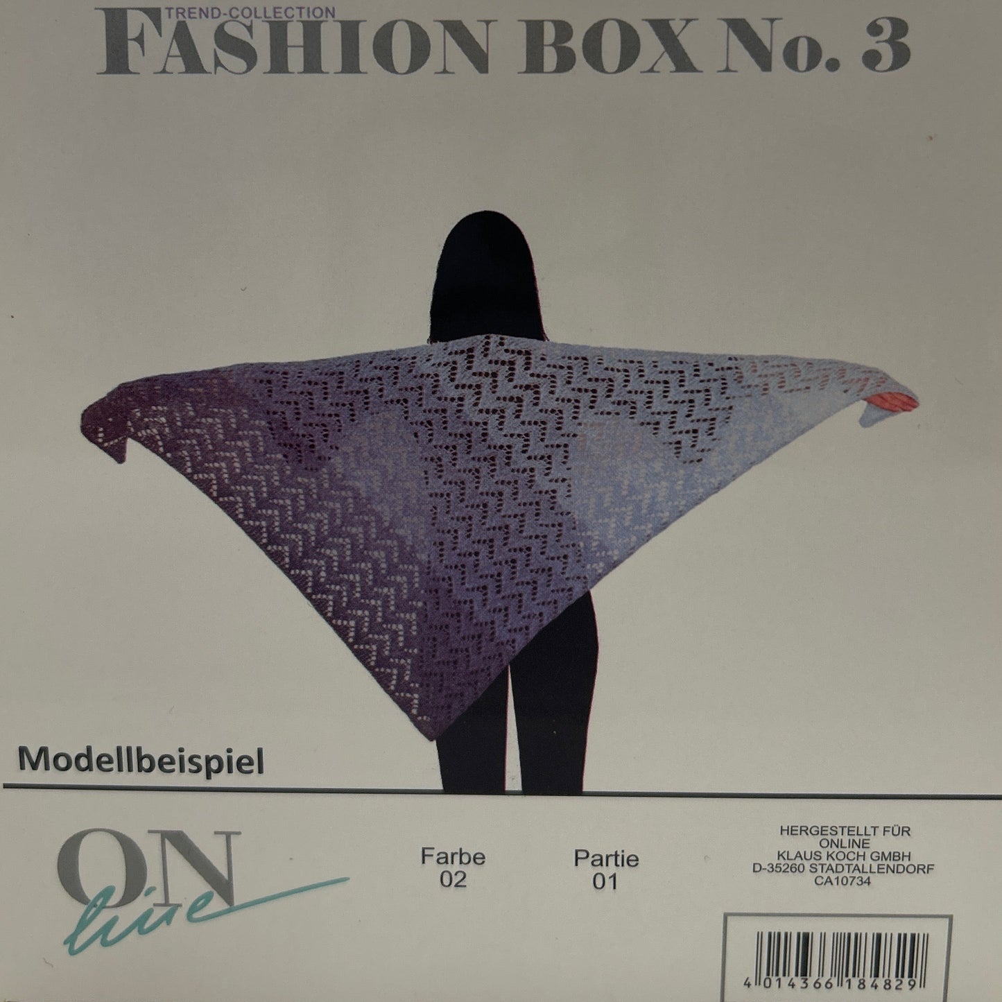 Gray fashion box with a purple and black patterned hat on a white background