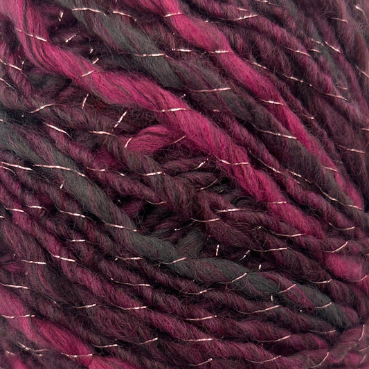 Ball of purple and black yarn on a white background