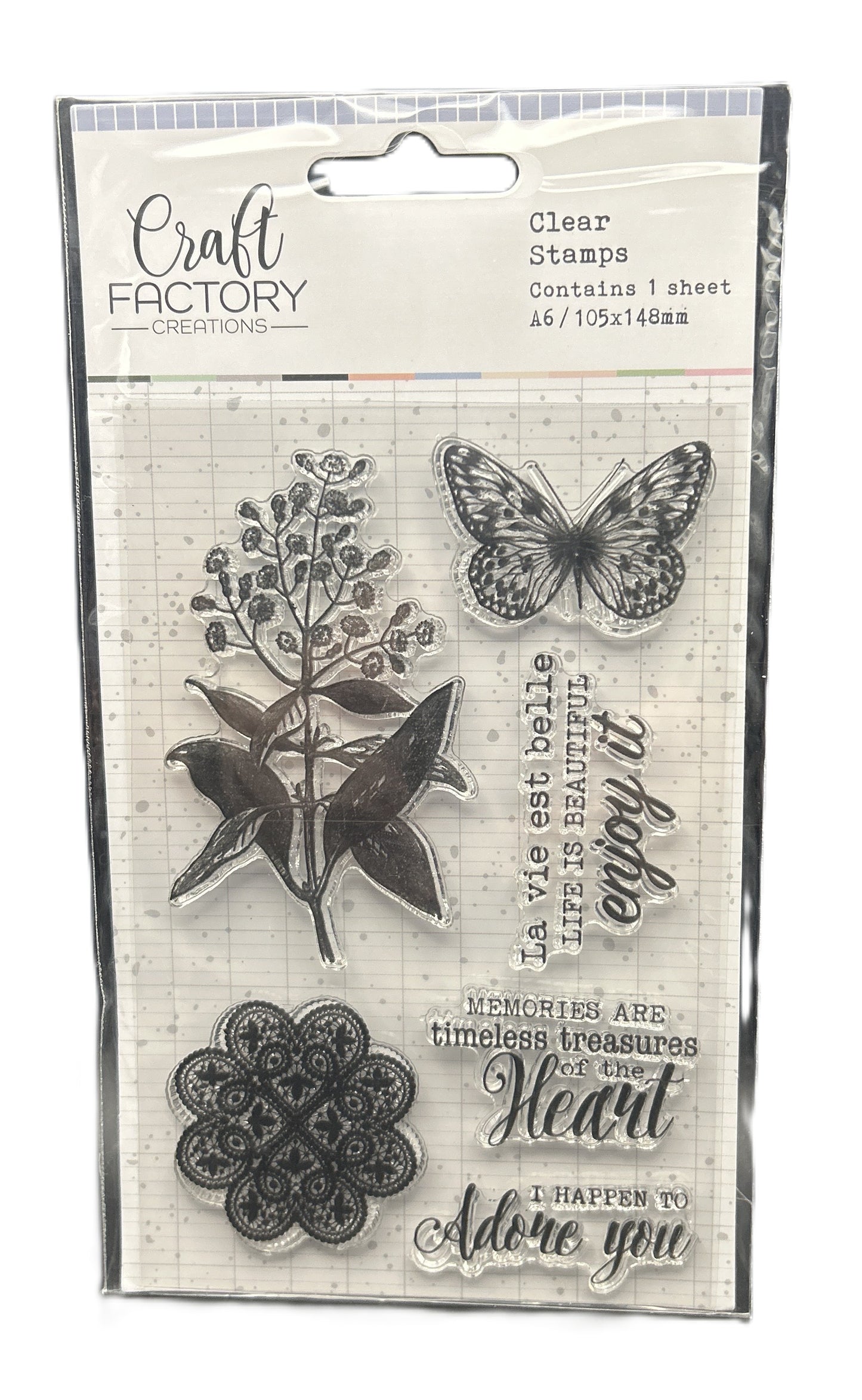 Packaged clear stamps with butterfly, floral, and decorative text design on a white background.