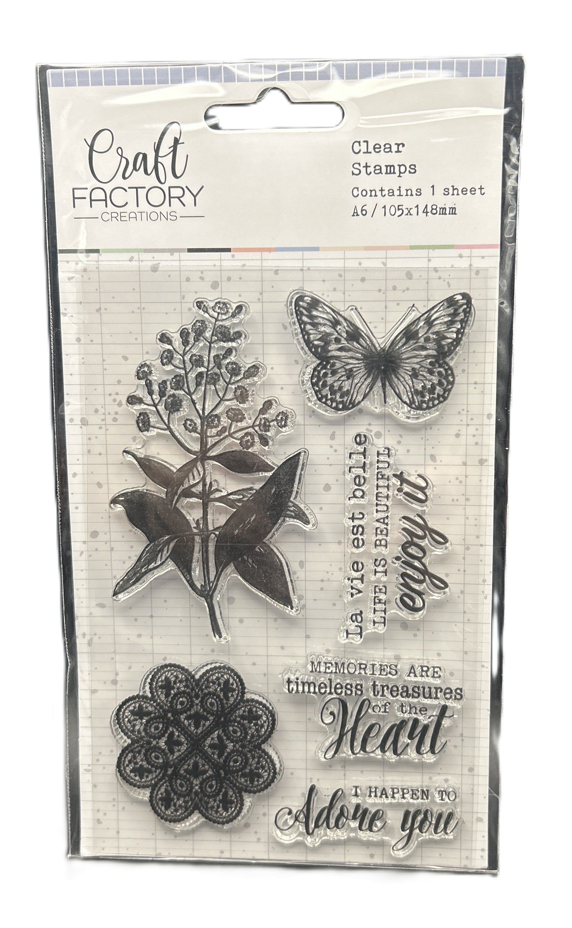 Packaged clear stamps with butterfly, floral, and decorative text design on a white background.