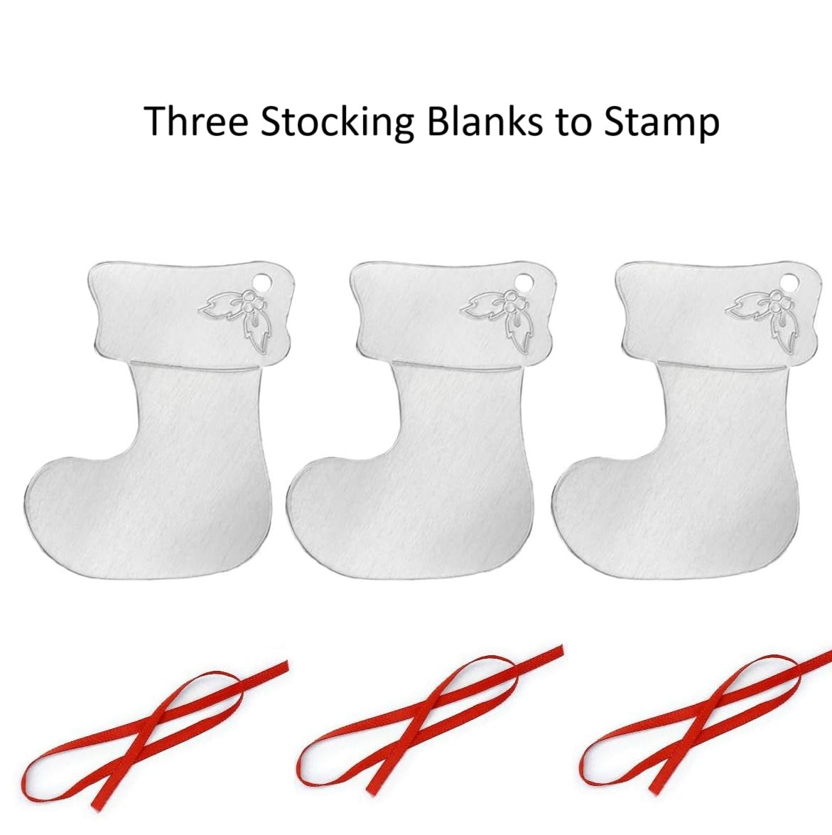 Three white stocking blanks with red ribbons on a white background