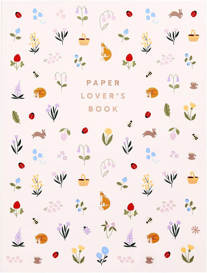 Patterned book cover with illustrations of flowers, animals, and baskets on a light background.