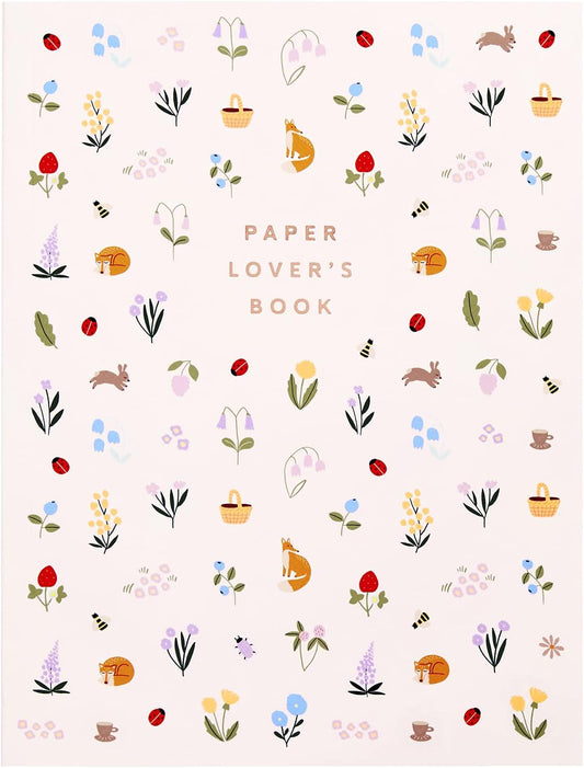 Patterned book cover with illustrations of flowers, animals, and baskets on a light background.