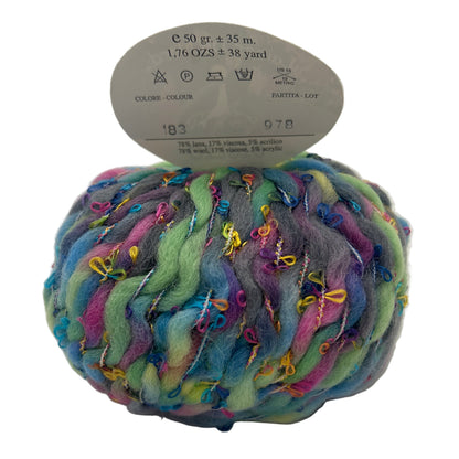 Multicolored skein of yarn with label on a white background