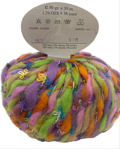 Multicolored skein of yarn with a label on a white background